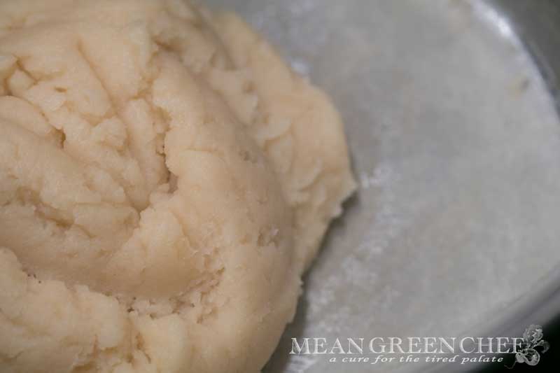 Pate a Choux Pastry raw dough cooking in a pot on the stove top.