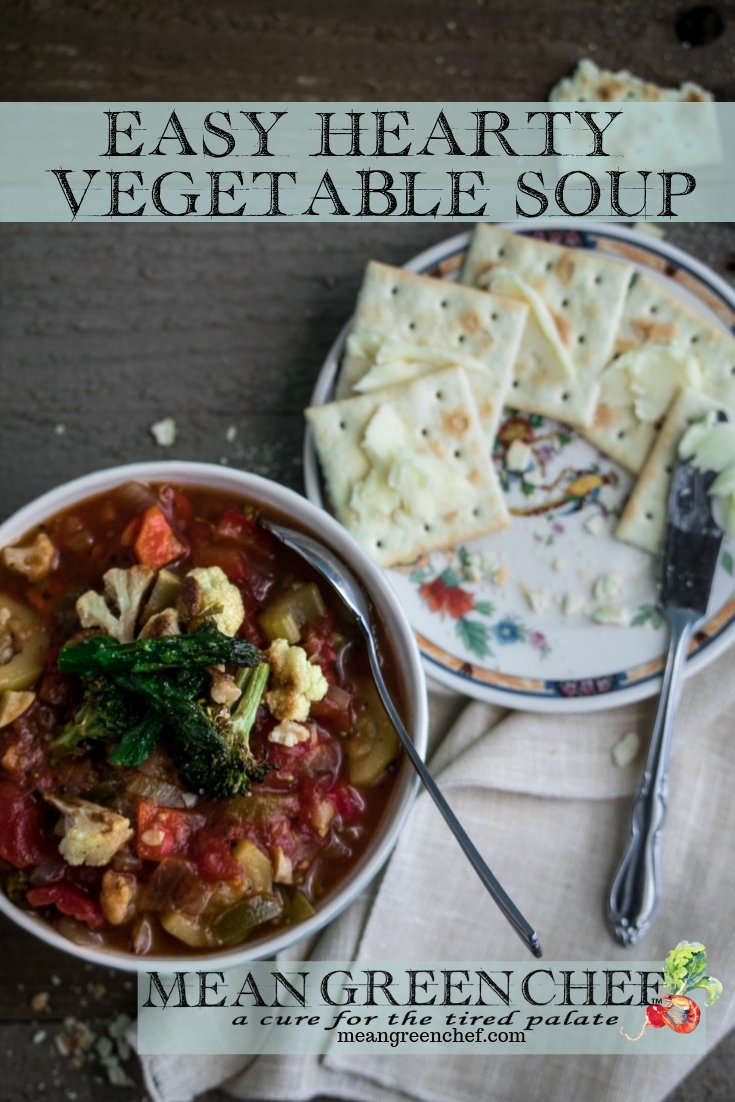 Overhead photo of a honeycomb pattern blue bowl filled with Hearty Vegetable Soup, Mean Green Chef.
