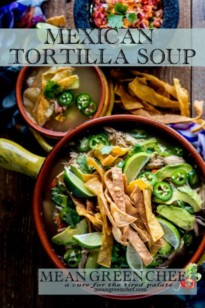 Overhead photo of Mexican Tortilla Chicken Soup Recipe in terracotta pot and bowls with crispy tortilla strips