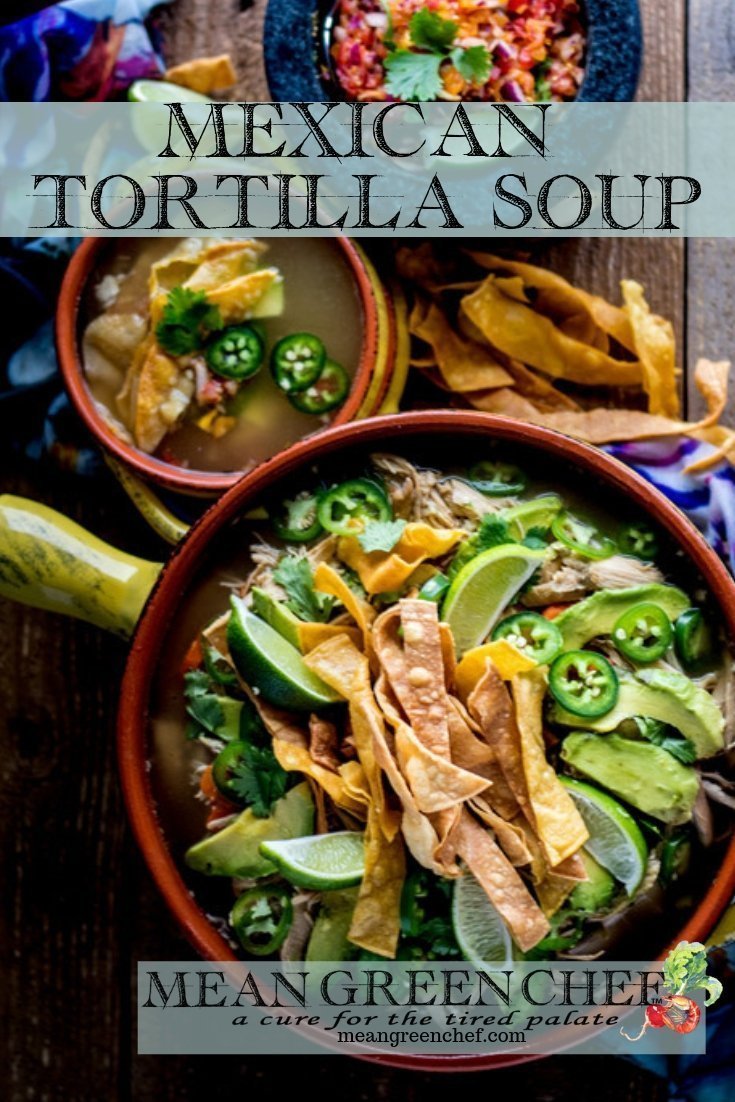 Overhead photo of Mexican Tortilla Chicken Soup Recipe in terracotta pot and bowls with crispy tortilla strips