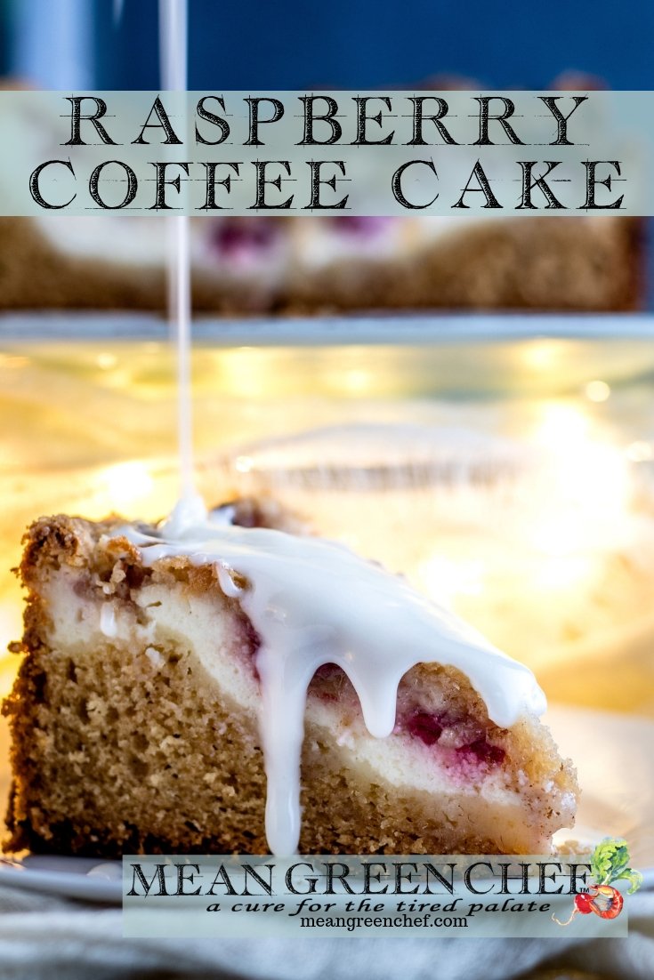 Side photo of Raspberry Coffee Cake with thick vanilla glaze being poured over the top.
