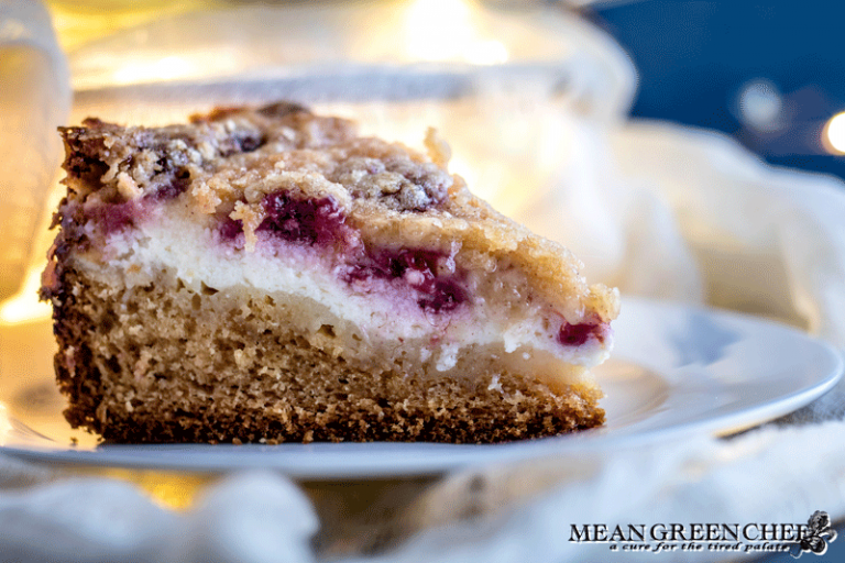 Side photo of Raspberry Coffee Cake showing layers of cheese and berries.