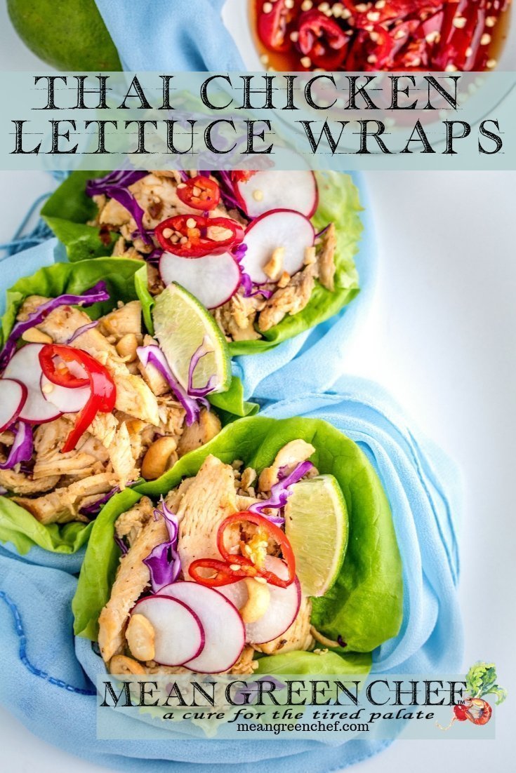 Thai Chicken Lettuce Wraps on a white background with Prik nam pla.