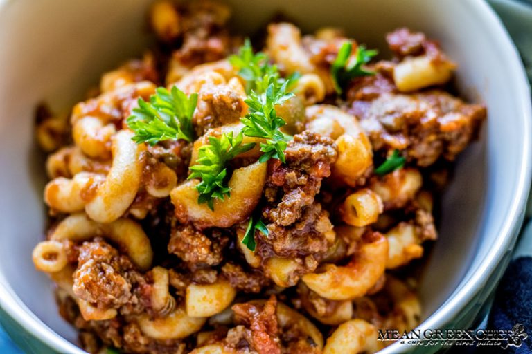 Close up of American Chop Suey garnished with curly parsley.