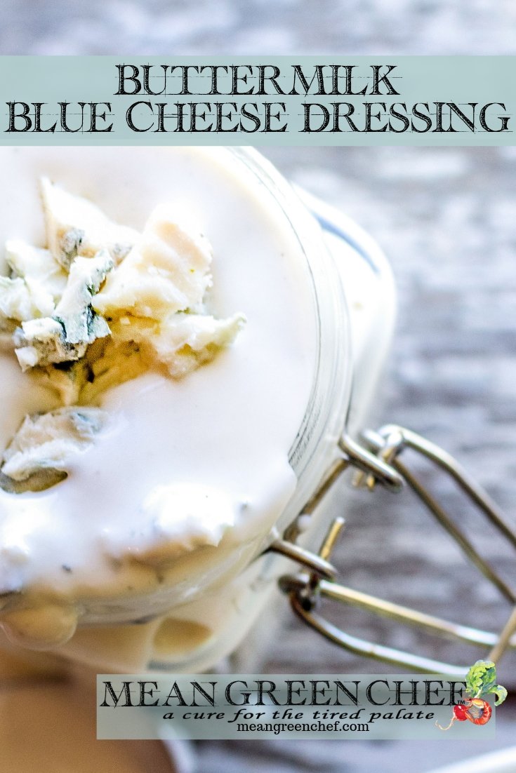 Buttermilk Blue Cheese Dressing in a glass jar next to a wedge salad.