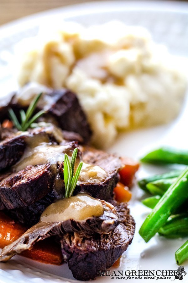 Plate of Red Wine Pot Roast made in the Instant Pot and served with mashed potatoes and sauteed green beans.