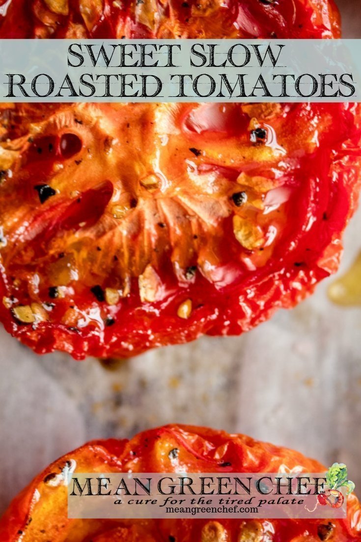 Close up of Sweet Slow Roasted Tomatoes on a sheet of parchment paper.