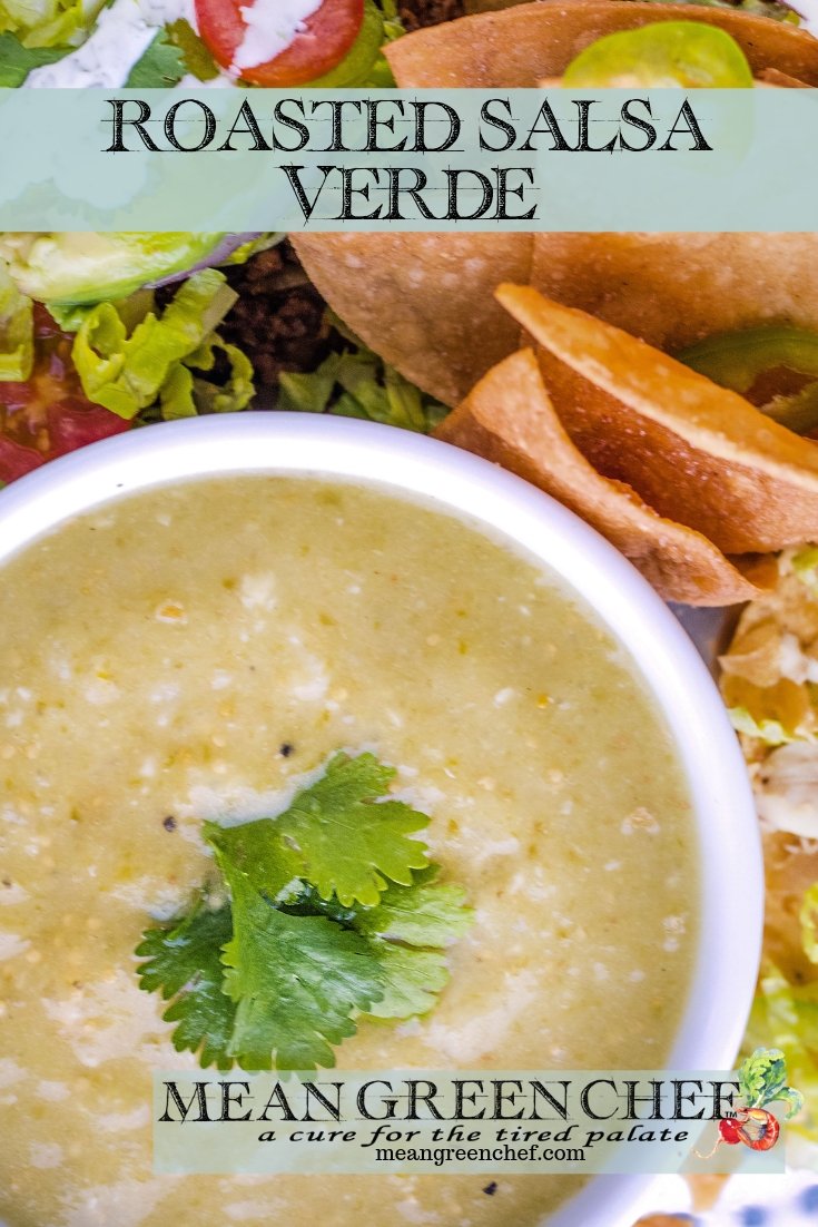 Bowl of Roasted Salsa Verde pictured with tostadas and fresh tortilla chips.
