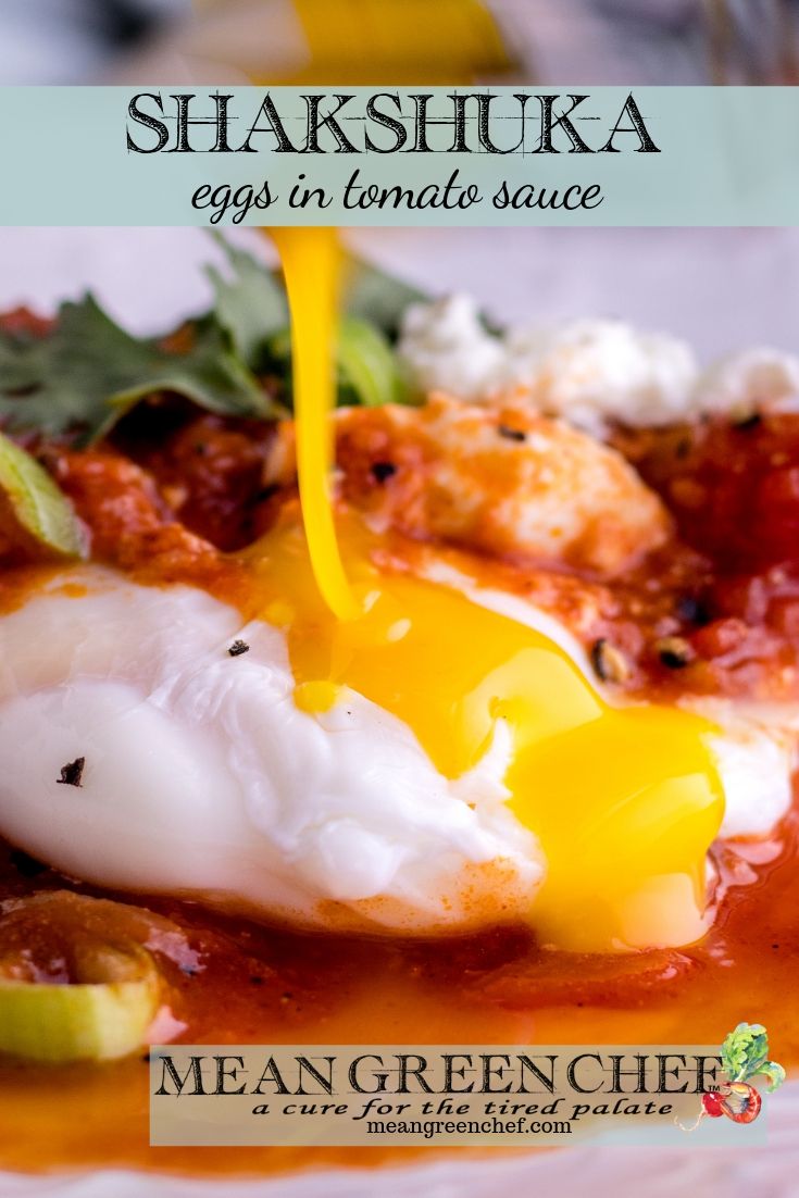 Egg yolk being broken with a fork.