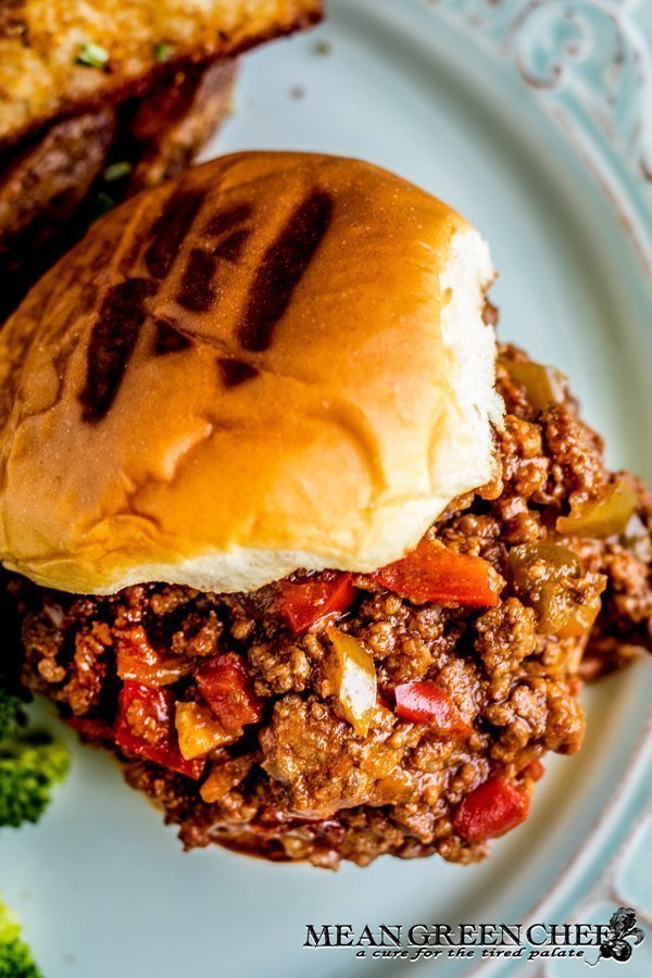 Extra Sloppy Joes on a bun with broccoli and fries.